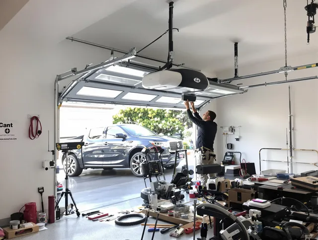 Millbury Garage Door Repair specialist installing smart garage door opener system in Millbury home