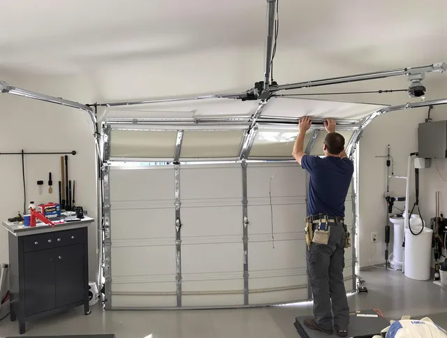 Millbury Garage Door Repair specialist performing precise section replacement on Millbury garage door